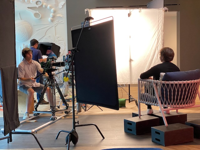 Interview lighting setup with coloured backdrop